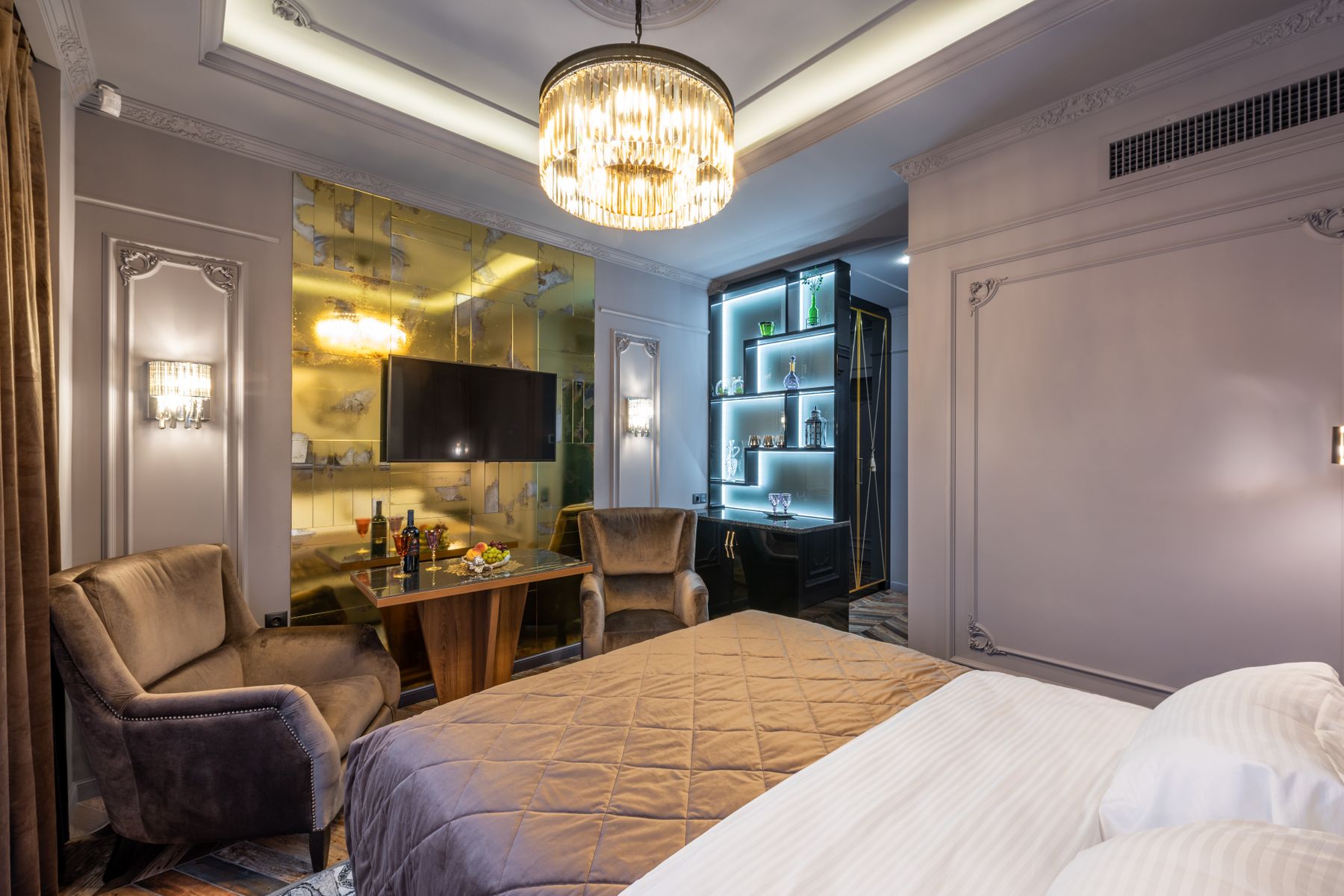 The master suite at dusk, wall to wall